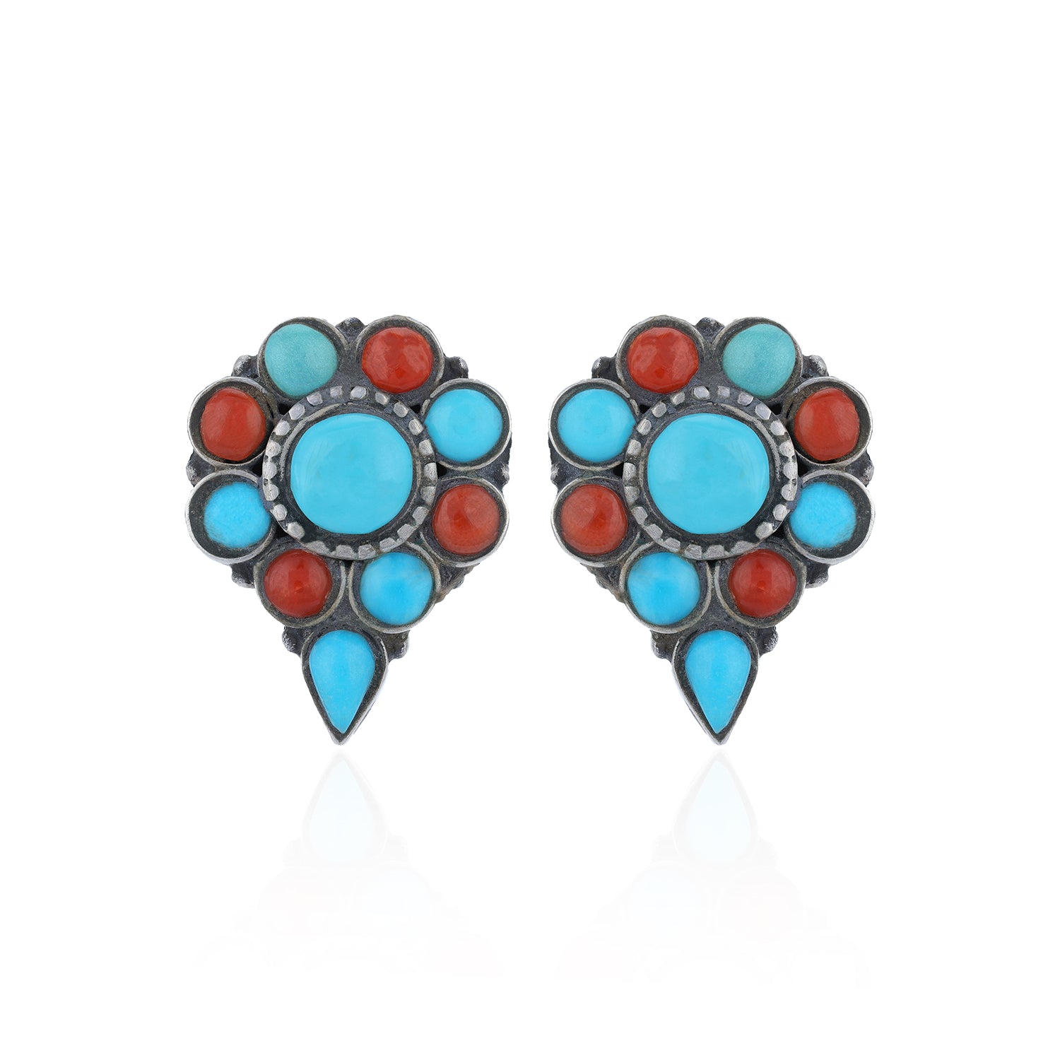 Pair of earrings with turquoise and red stones on a white background