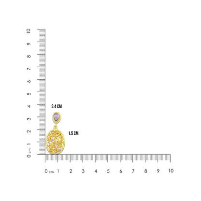 Gold pendant with a purple stone next to a ruler on a white background