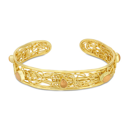 Gold filigree bracelet on a white background
