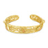 Gold filigree bracelet on a white background