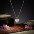 Heart-shaped pendant necklace on a dark background with decorative elements