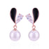 Pearl earrings with black and clear gemstones