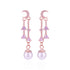 Pair of pink earrings with moon designs and pearl-like beads on a white background