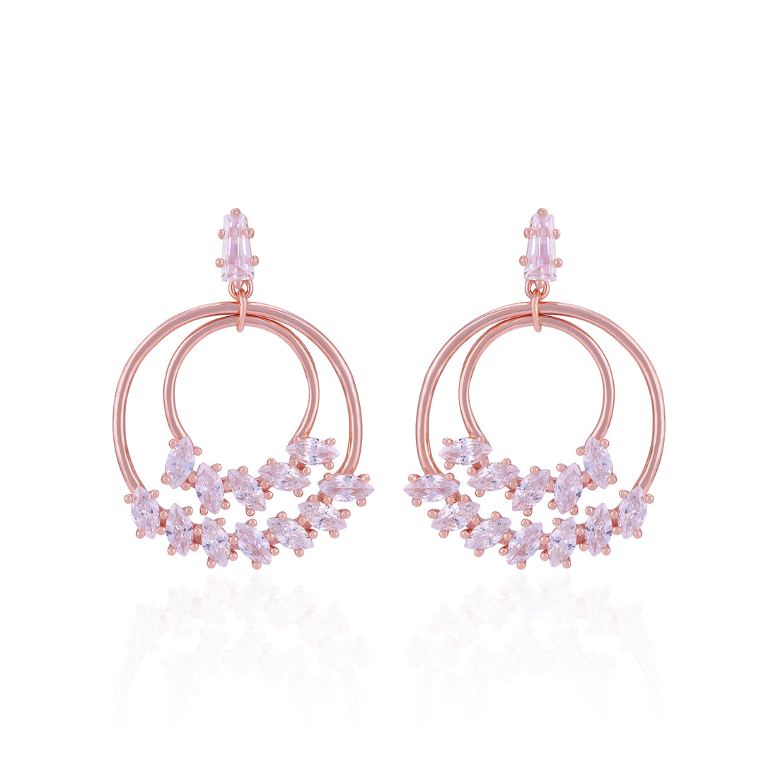 Rose gold hoop earrings with floral designs on a white background