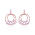 Rose gold hoop earrings with floral designs on a white background