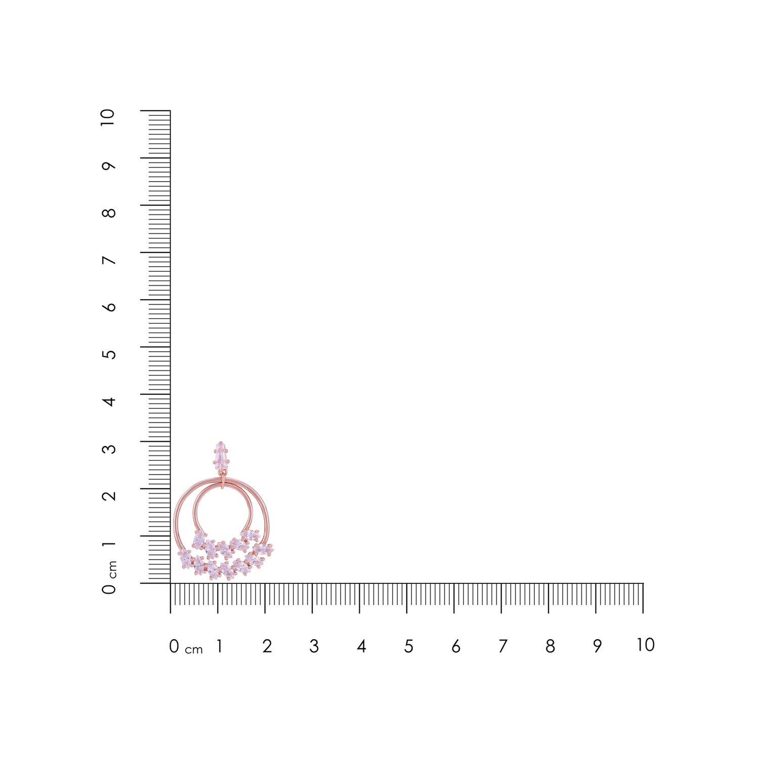 Jewelry with pink gemstones next to a ruler on a white background