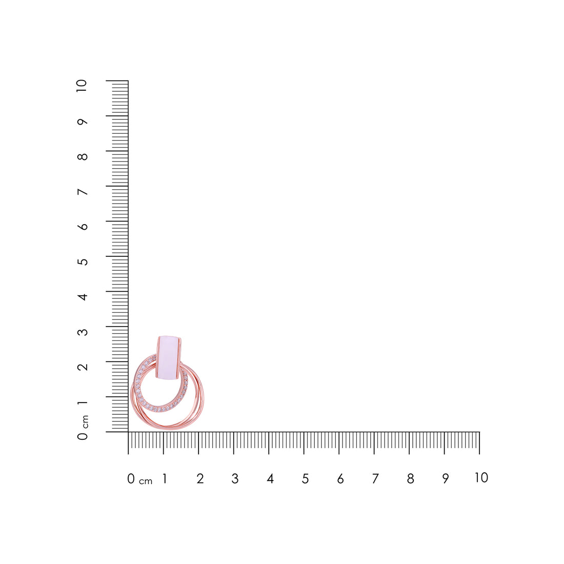 Small pink ring with a clear gemstone on a white background with a ruler for scale.