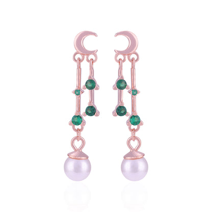 Rose gold earrings with green gemstones and pearl drops on a white background