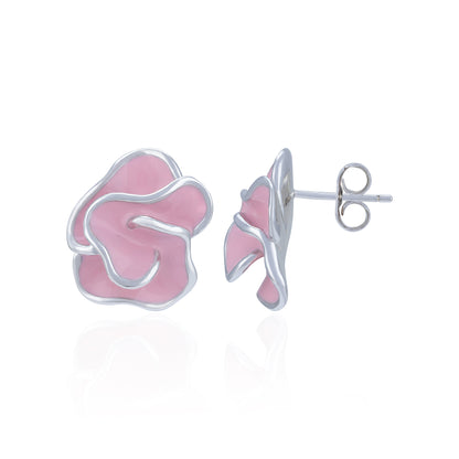 Pink and silver earrings on a white background