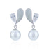 Pearl earrings with silver teardrop-shaped accents on a white background