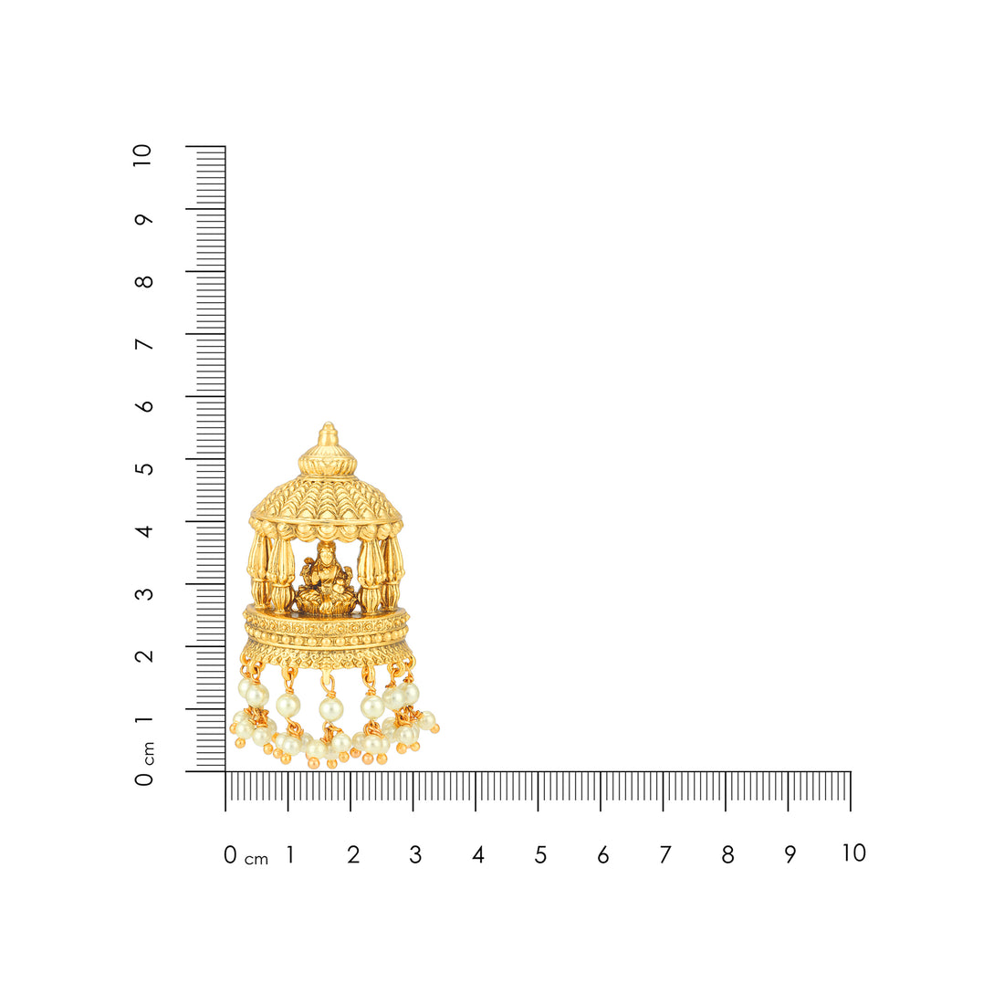 Gold pendant with intricate design next to a ruler for scale on a white background