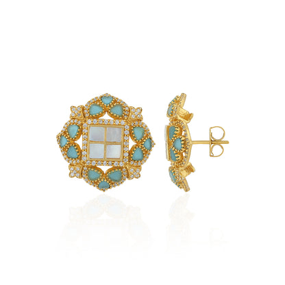 Gold and turquoise earrings on a white background