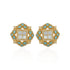 Pair of ornate earrings with gold frame, turquoise stones, and white center on a white background