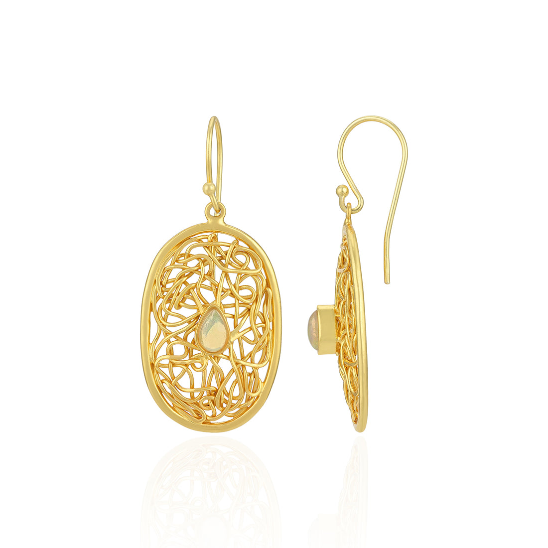 Gold filigree earrings on a white background