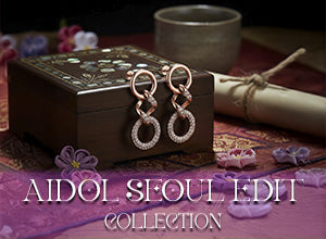 Aidol Seoul Edit Collection Banner Featuring Elegant Rose Gold Earrings On Decorative Box
