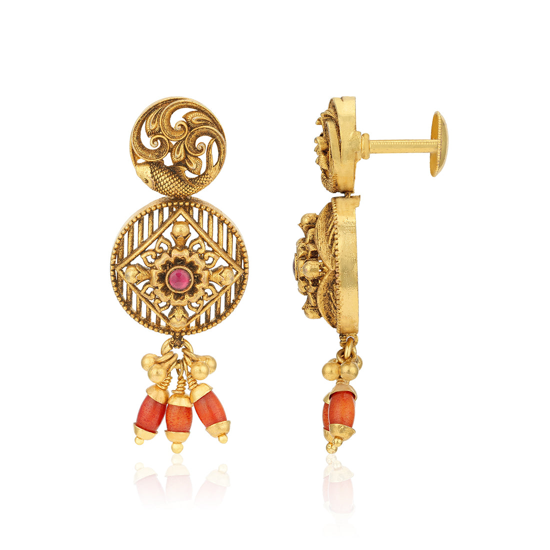 Gold earrings with intricate designs and red stones on a white background