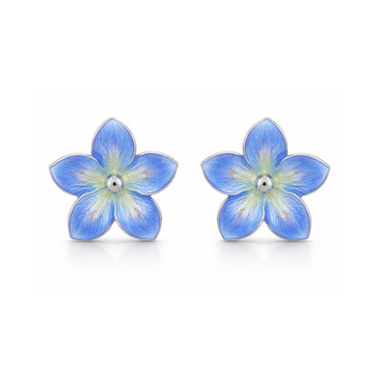 Pair of blue flower-shaped earrings on a white background