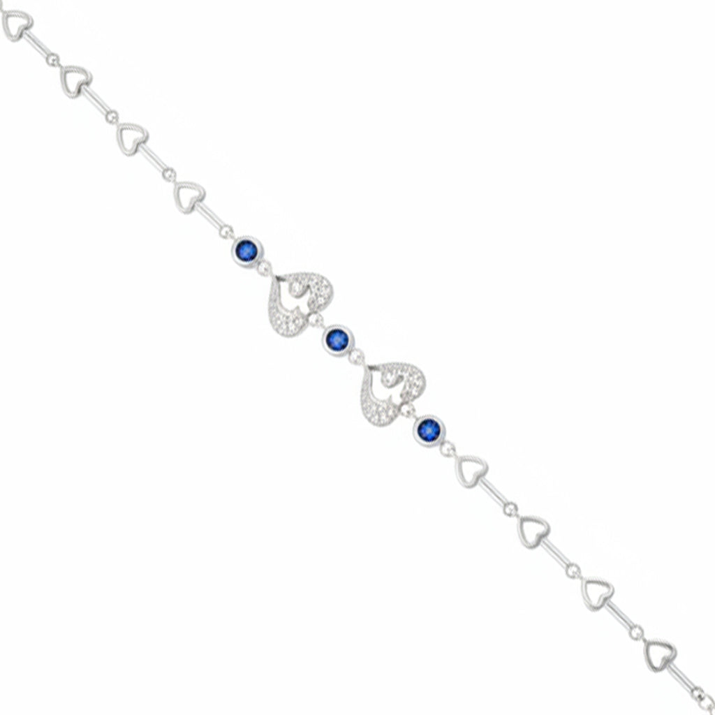 Silver bracelet with heart-shaped links and blue gemstones on a white background