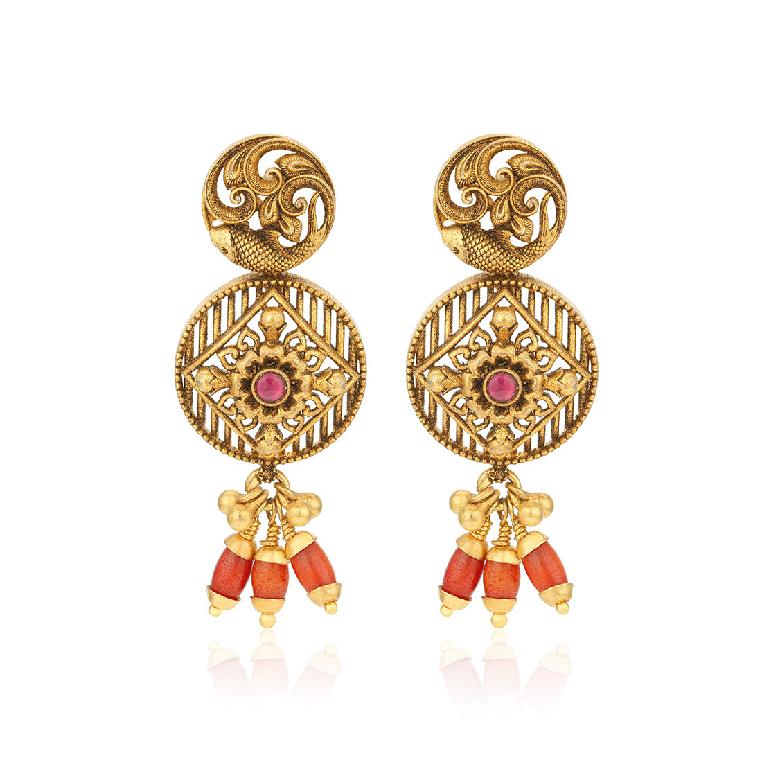 Gold earrings with red gemstones on a white background
