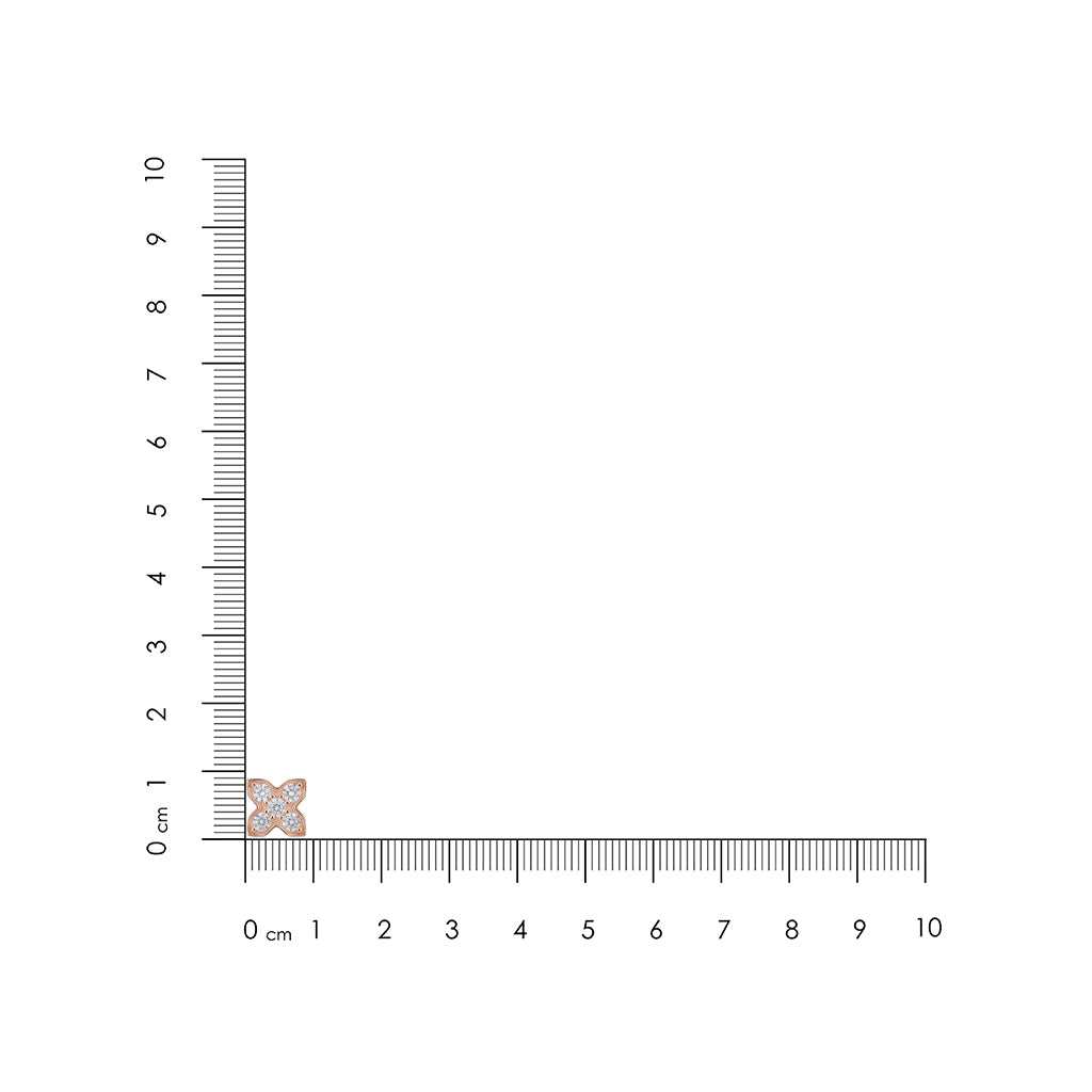 Small diamond earring next to a ruler on a white background