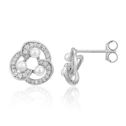 Silver earrings with pearls and small diamonds on a white background