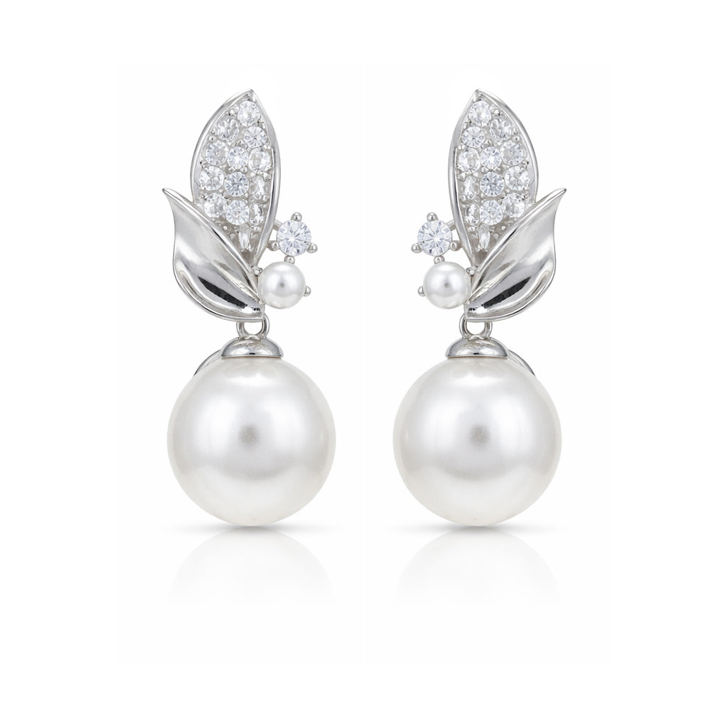 Pair of pearl earrings with diamond accents on a white background