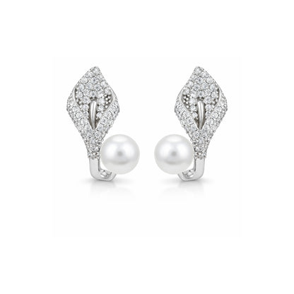 Pair of silver earrings with pearls on a white background