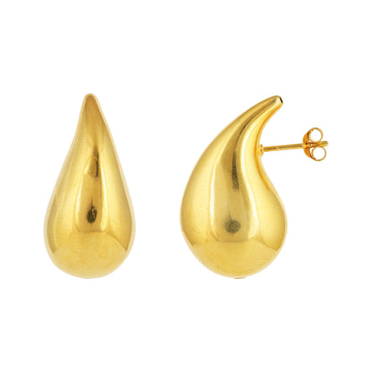 Gold teardrop earrings on a white background