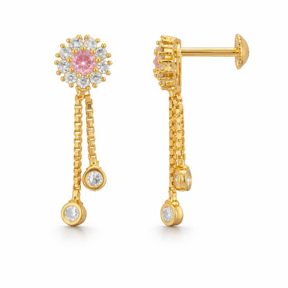 Gold earrings with pink gemstone and dangling beads on a white background