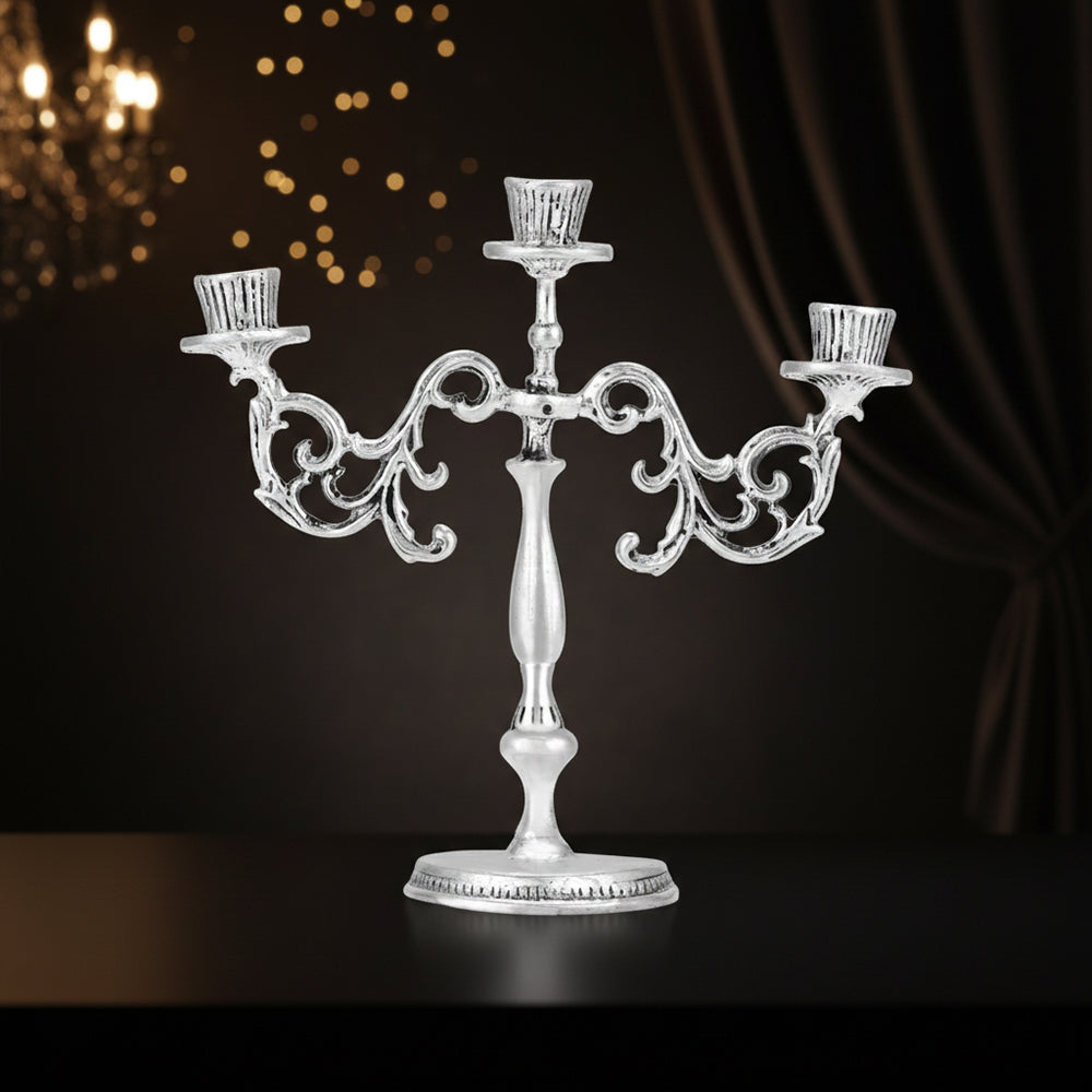 Silver candelabra on a dark background