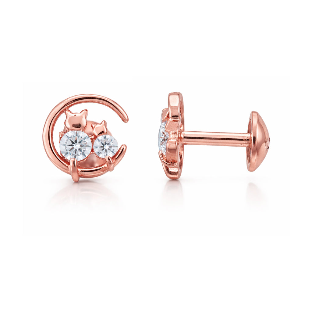 Rose gold earrings with clear gemstones on a white background