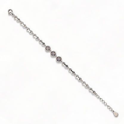 Silver bracelet with diamond-like beads on a white background