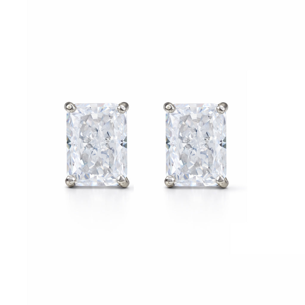 Pair of diamond stud earrings on a white background