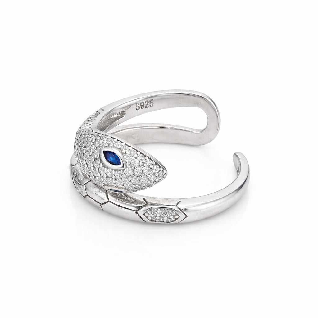 Silver snake-shaped ring with a blue gem on a white background