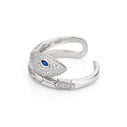 Silver snake-shaped ring with a blue gem on a white background
