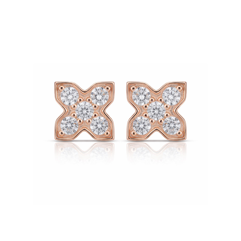 Rose gold earrings with diamond accents on a white background