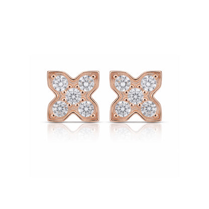 Rose gold earrings with diamond accents on a white background