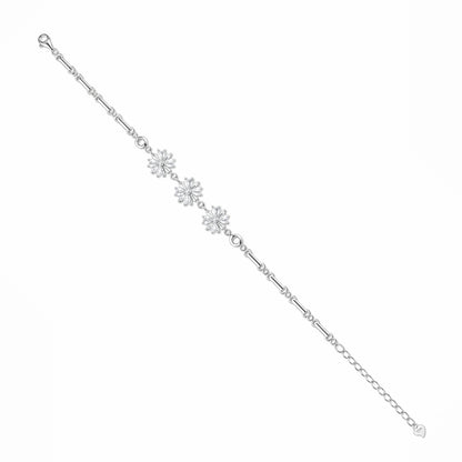 Silver bracelet with floral charms on a white background