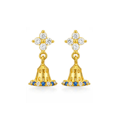 Gold earrings with blue and clear gemstones on a white background