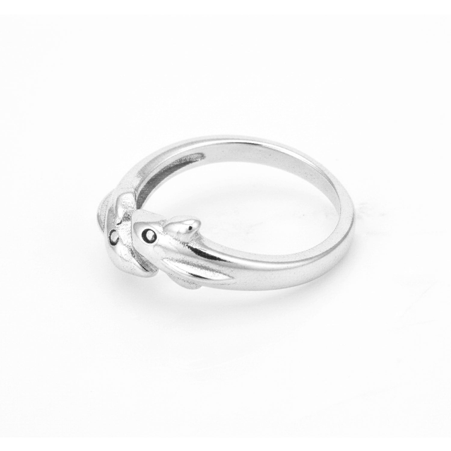 Silver ring with a small black gemstone on a white background