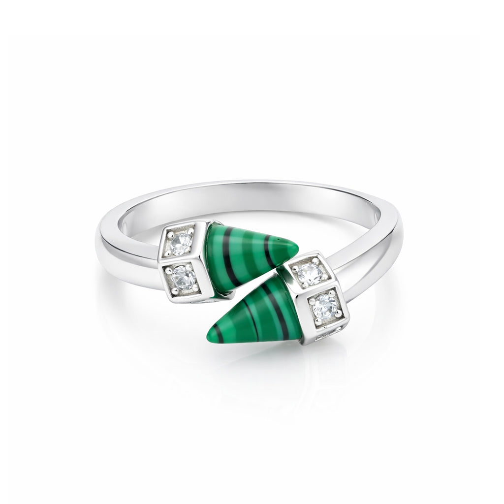 Silver ring with green gemstones and diamonds on a white background