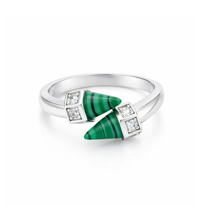 Silver ring with green gemstones and diamonds on a white background