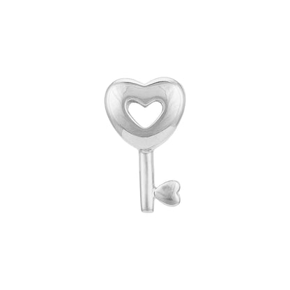 Silver key-shaped charm with a heart design on a white background