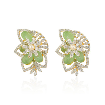 Pair of earrings with green gemstones and gold accents on a white background