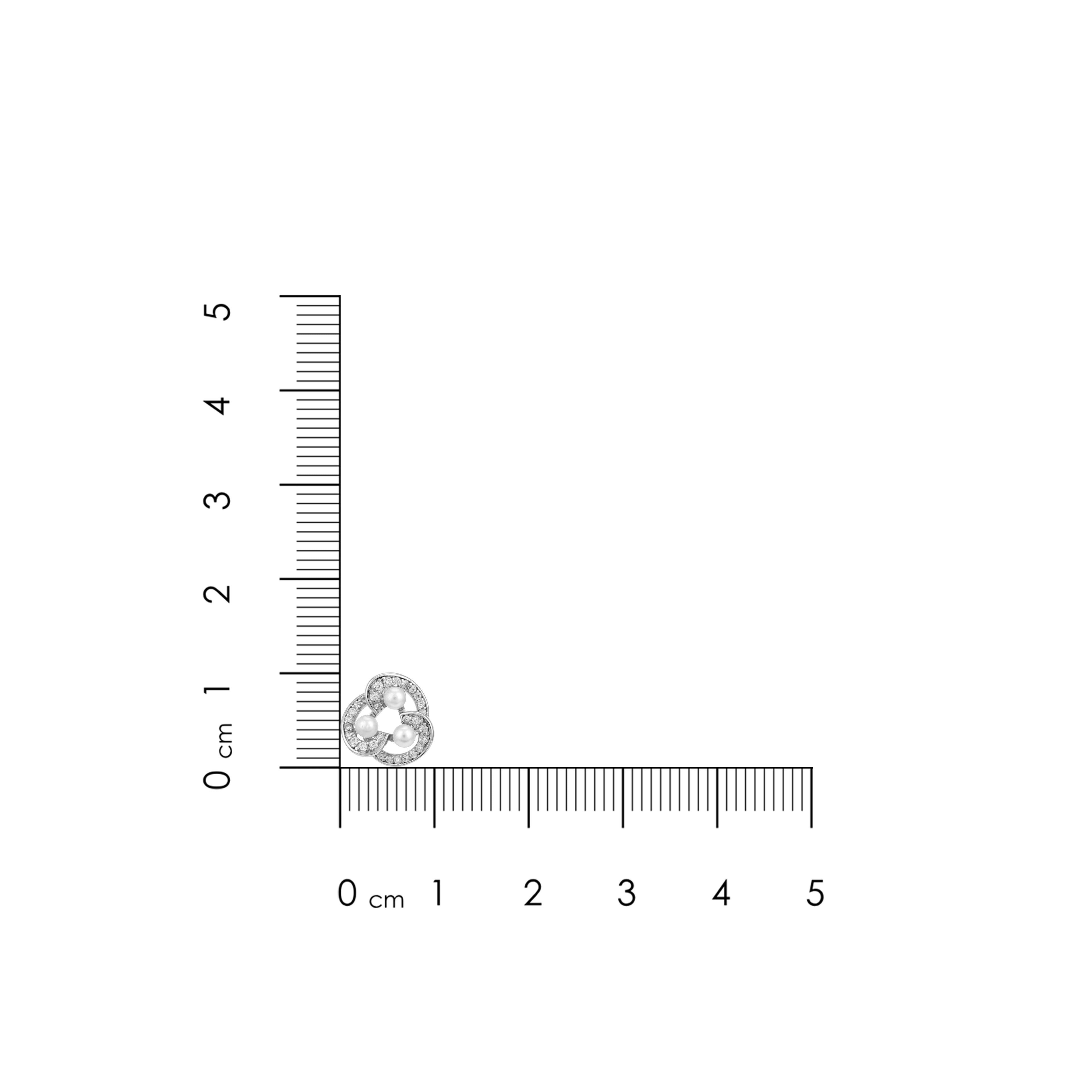 Heart-shaped diamond ring with a ruler for scale on a white background
