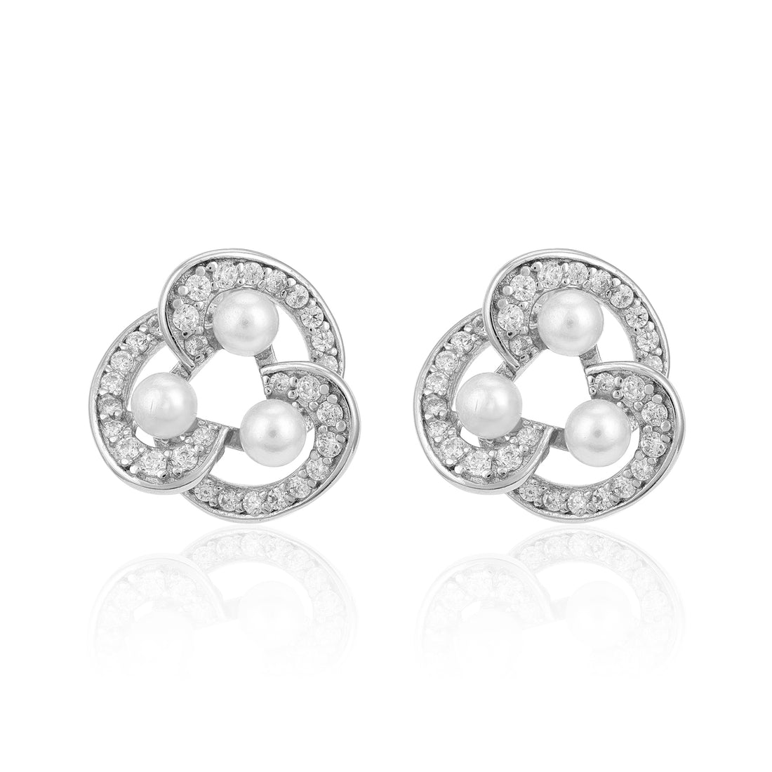 Pair of silver earrings with pearls and clear stones on a white background