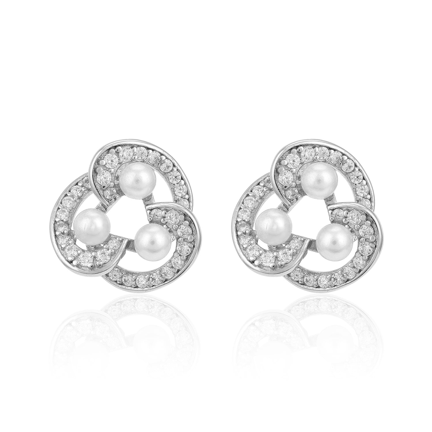 Pair of silver earrings with pearls and clear stones on a white background