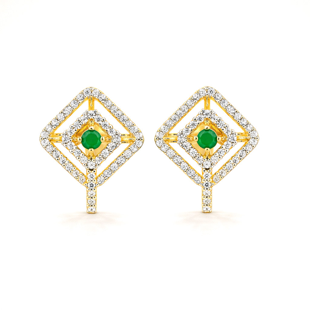 Pair of gold earrings with green gemstones on a white background
