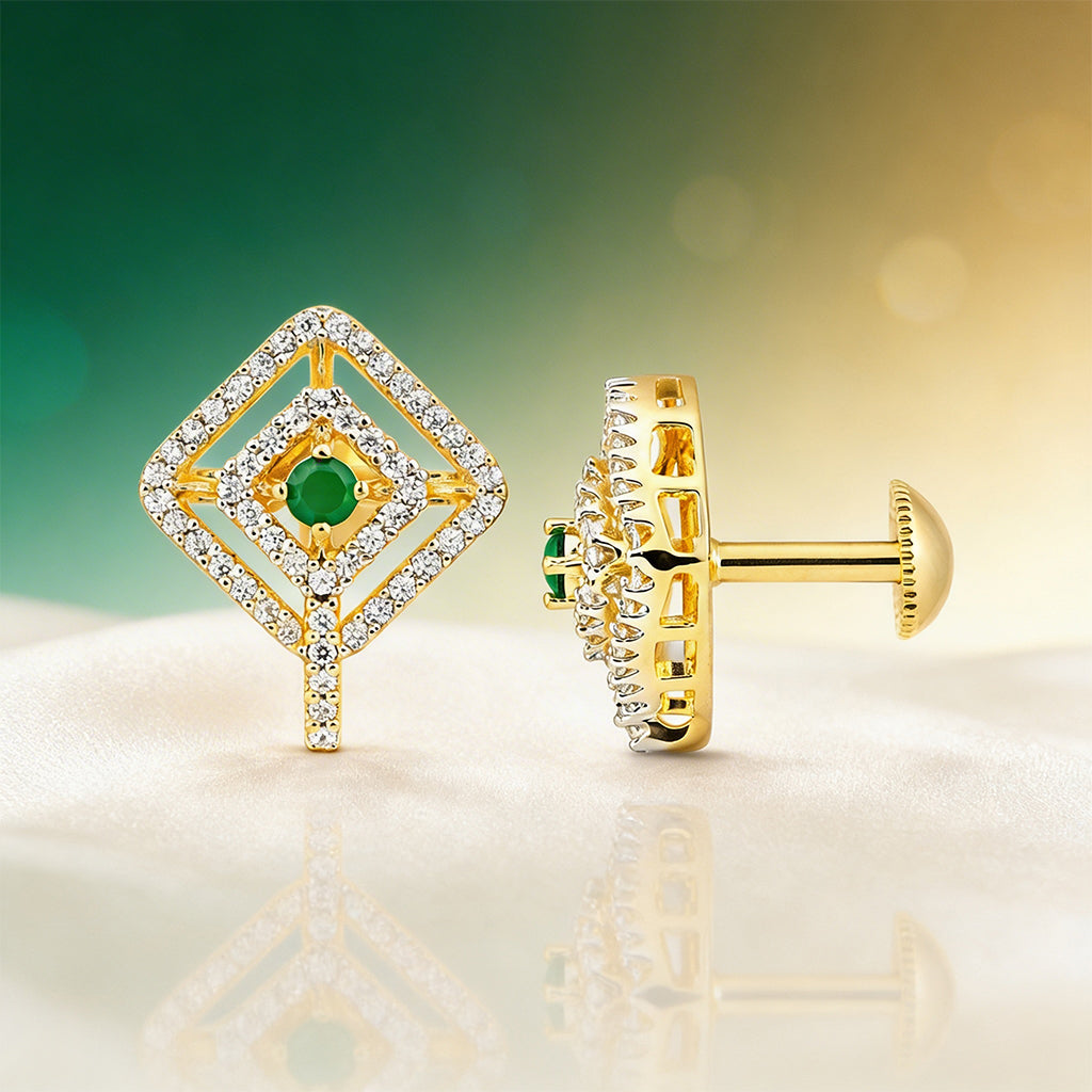 Gold earrings with green gemstones on a reflective surface with a gradient background