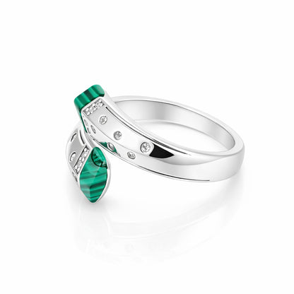 Silver ring with green gemstone on a white background
